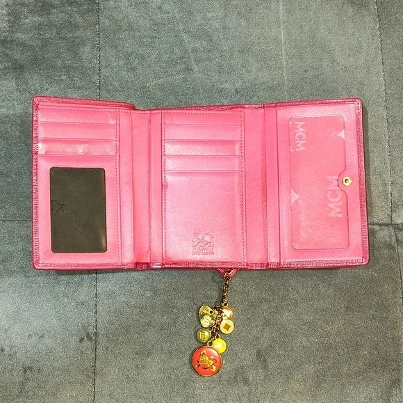 EUC MCM SAFFIANO LEATHER COMPACT WALLET DECORATIVE METAL MCM BAGDES & CHARMS